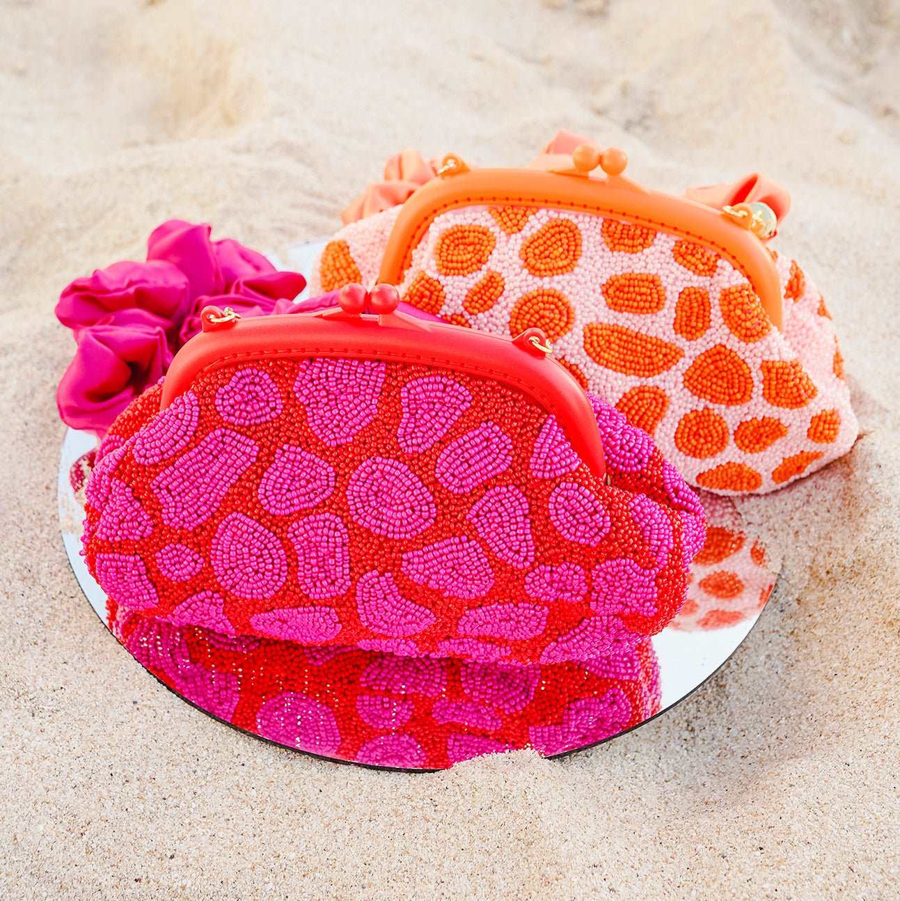 ARNOLDI Jean Hand-beaded Clutch, in Red & Pink - Premium from BrunnaCo - Just $136.50! Shop now at ZLA