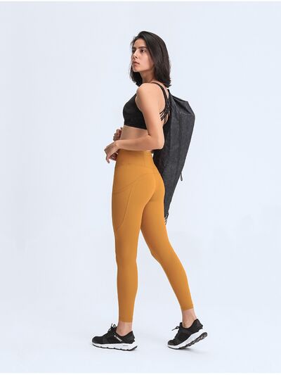 Double Take Wide Waistband Leggings with Pockets - Premium from Trendsi - Just $38! Shop now at ZLA