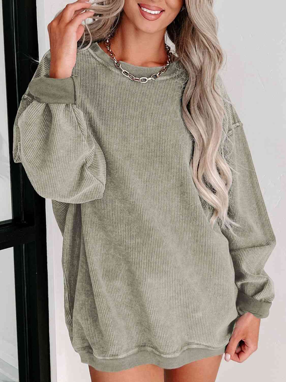 Round Neck Dropped Shoulder Sweatshirt - Premium from Trendsi - Just $39! Shop now at ZLA