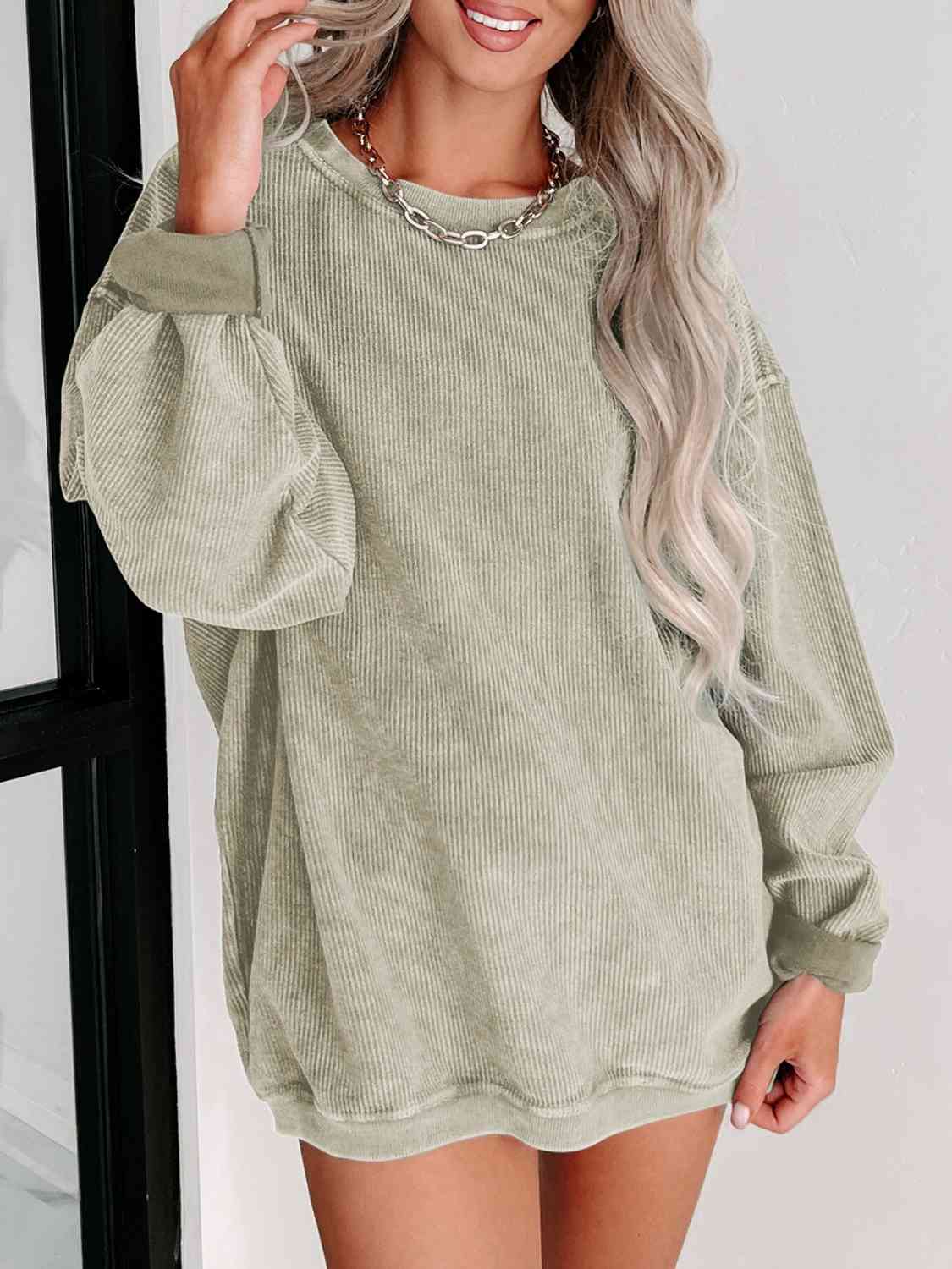 Round Neck Dropped Shoulder Sweatshirt - Premium from Trendsi - Just $39! Shop now at ZLA